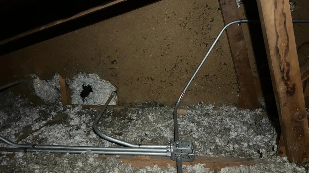 Attic conduit through framing
