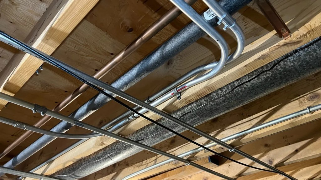 Conduit run joists overhead