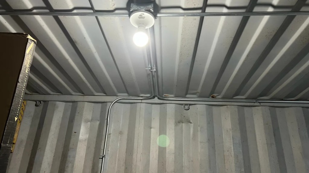 Container ceiling conduit light
