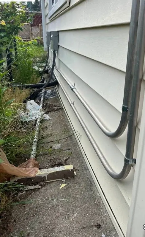 Service mast riser siding